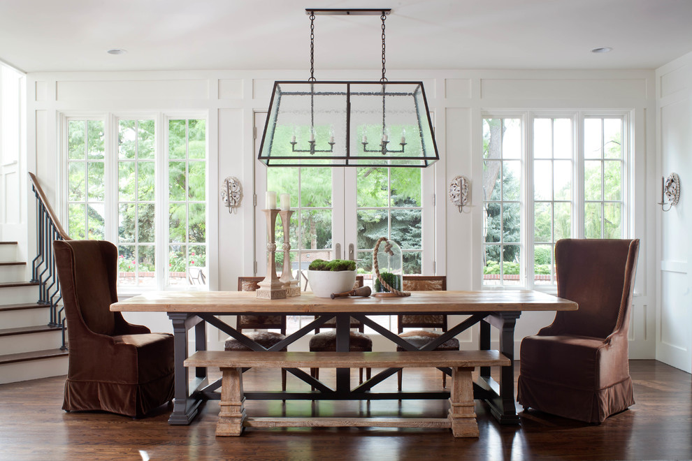 This is an example of a large traditional dining room in Denver with white walls and dark hardwood floors.