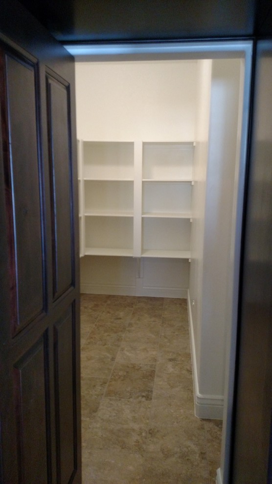 Inspiration for a large transitional u-shaped porcelain tile open concept kitchen remodel with an undermount sink, raised-panel cabinets, dark wood cabinets, granite countertops, beige backsplash, stone tile backsplash, stainless steel appliances and an island