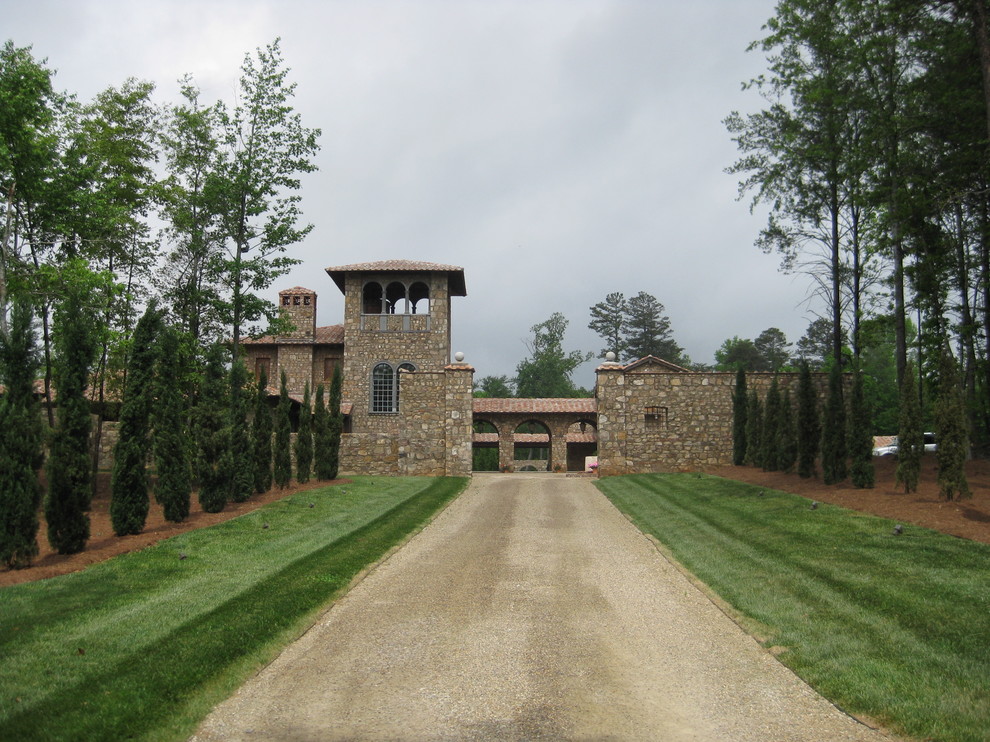 This is an example of a mediterranean exterior in Atlanta with stone veneer.