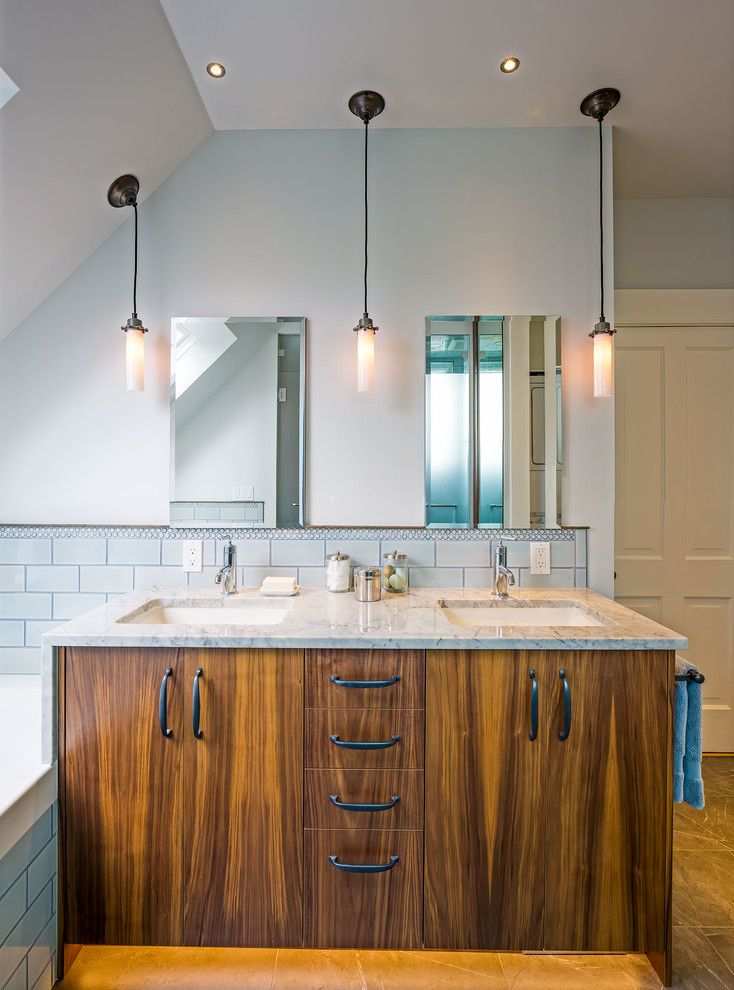 Inspiration for a transitional blue tile and ceramic tile ceramic tile bathroom remodel in Other with an undermount sink, flat-panel cabinets, medium tone wood cabinets, marble countertops, a two-piece toilet and blue walls