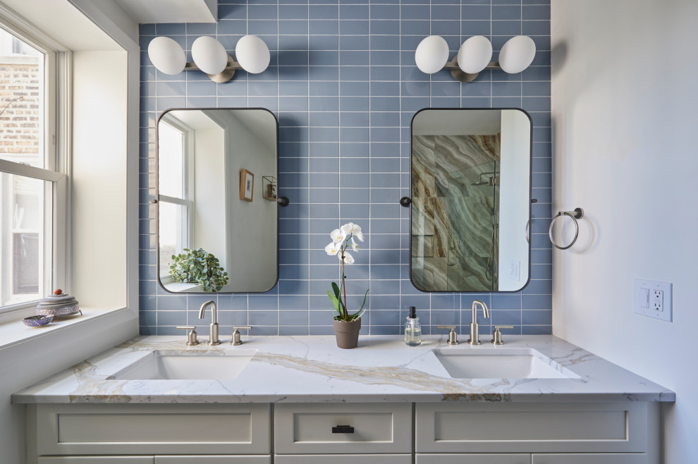 Design ideas for a mid-sized transitional master wet room bathroom in Chicago with recessed-panel cabinets, white cabinets, blue tile, porcelain tile, blue walls, porcelain floors, an undermount sink, quartzite benchtops, grey floor, a hinged shower door, white benchtops, a niche, a double vanity and a freestanding vanity.