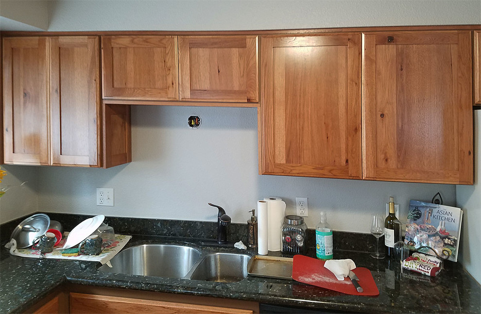 Kitchen - large u-shaped brown floor kitchen idea with shaker cabinets and no island