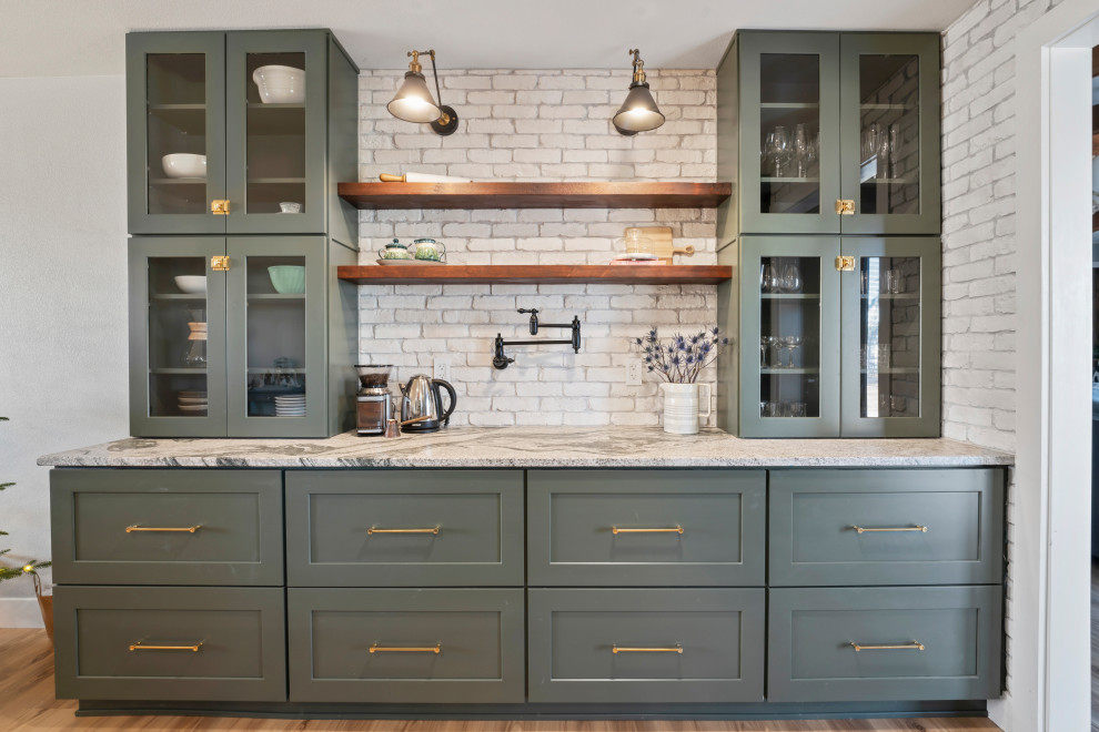 Large country l-shaped eat-in kitchen in Denver with a farmhouse sink, shaker cabinets, green cabinets, granite benchtops, white splashback, brick splashback, stainless steel appliances, vinyl floors, with island, beige floor, grey benchtop and recessed.