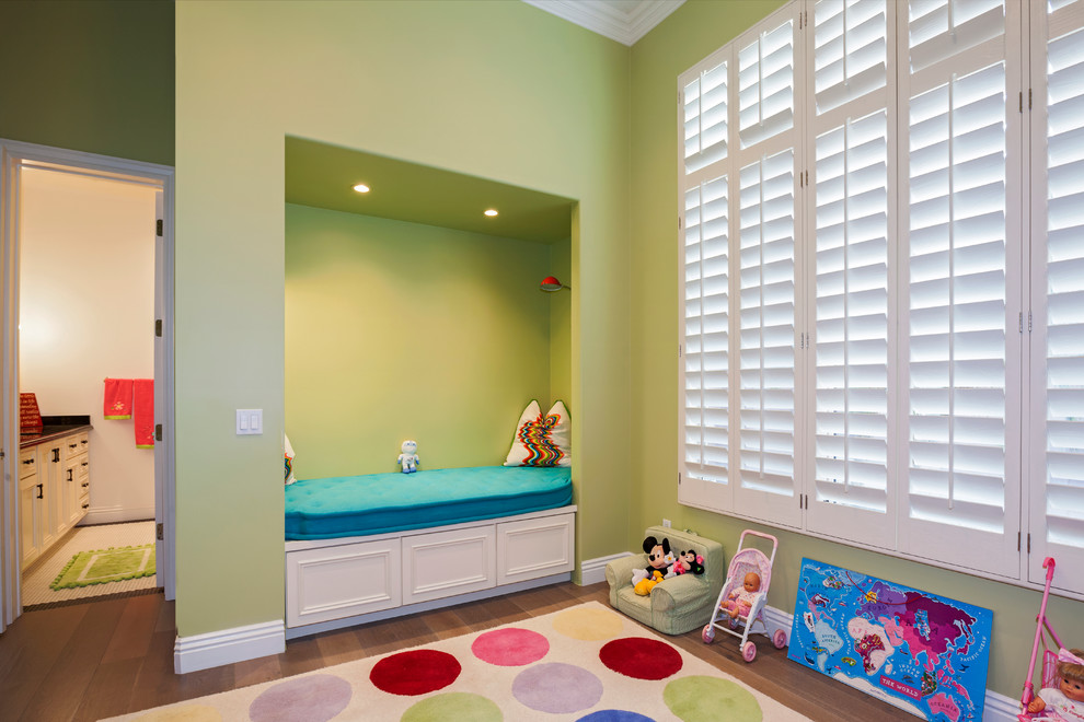 Transitional kids' playroom in Phoenix with green walls and medium hardwood floors for kids 4-10 years old.
