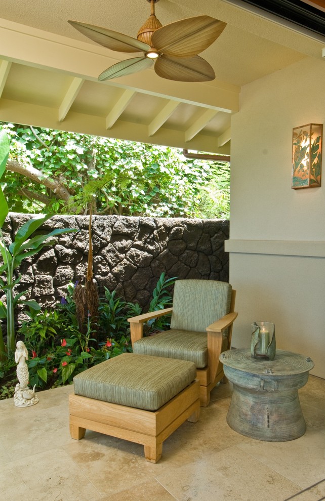 Design ideas for a tropical patio in Hawaii with a roof extension.