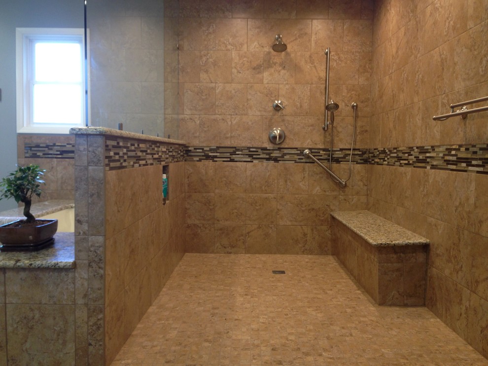 Inspiration for a transitional master brown tile and porcelain tile corner shower remodel with an undermount tub