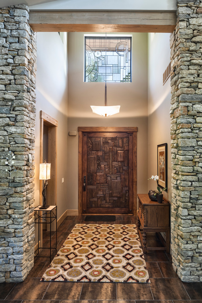 Design ideas for a transitional foyer in Cincinnati with beige walls, a single front door and a dark wood front door.