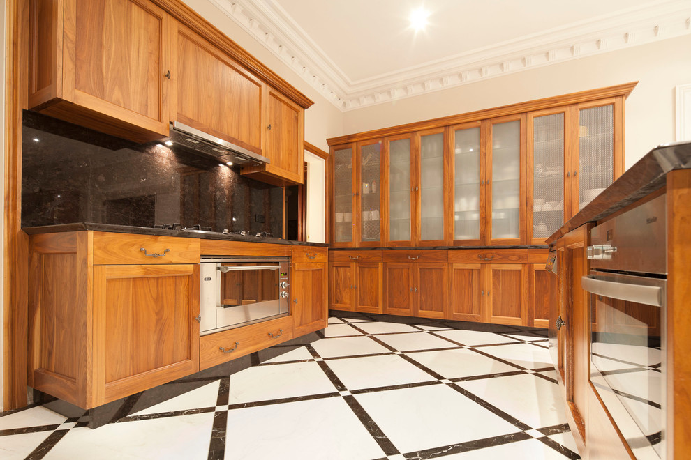 Design ideas for a large traditional u-shaped eat-in kitchen in Sydney with an undermount sink, beaded inset cabinets, medium wood cabinets, granite benchtops, black splashback, stainless steel appliances, marble floors and with island.