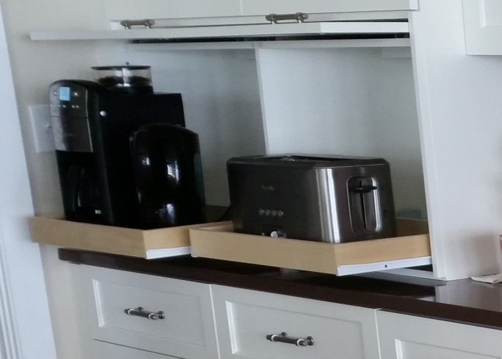 Example of a transitional eat-in kitchen design in Boston with a double-bowl sink, recessed-panel cabinets, white cabinets, quartz countertops, brown backsplash, glass tile backsplash, stainless steel appliances and an island