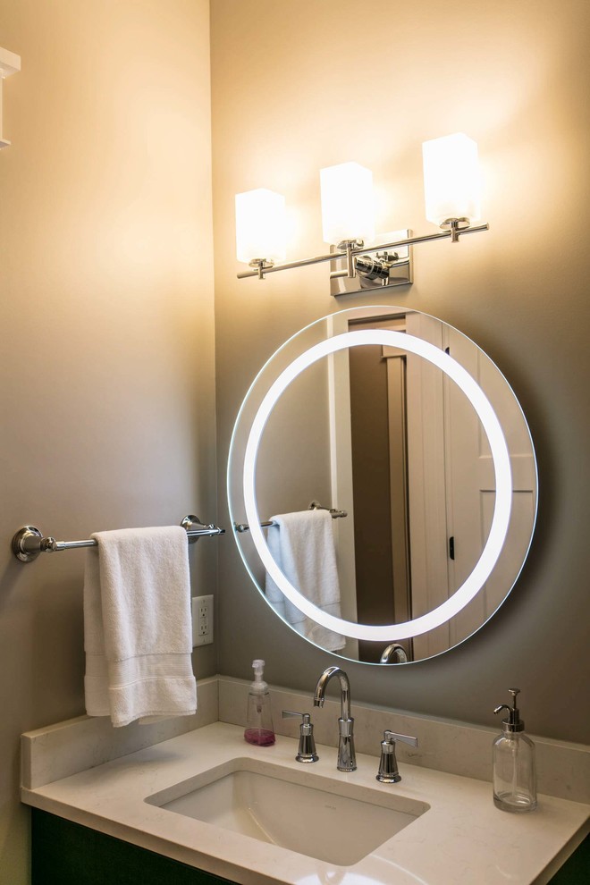 Transitional home design photo with an undermount sink, quartz countertops and white countertops