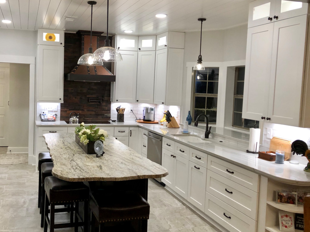 Inspiration for a mid-sized country galley porcelain tile, gray floor and shiplap ceiling kitchen pantry remodel in Dallas with an undermount sink, shaker cabinets, white cabinets, quartzite countertops, white backsplash, ceramic backsplash, stainless steel appliances, an island and gray countertops