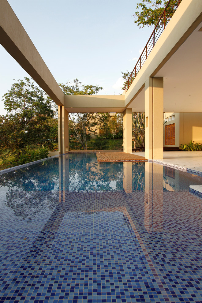 This is an example of a contemporary rectangular pool in Other.