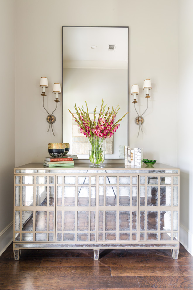 Mid-sized transitional foyer in New Orleans with white walls and dark hardwood floors.