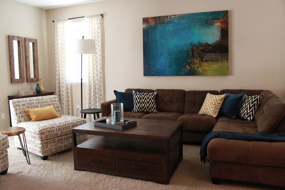 This is an example of a mid-sized eclectic enclosed living room in Phoenix with beige walls, carpet and no fireplace.