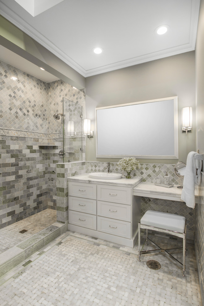 This is an example of a traditional bathroom in Minneapolis with shaker cabinets, white cabinets, an open shower, white tile, stone tile, grey walls, marble floors and a vessel sink.