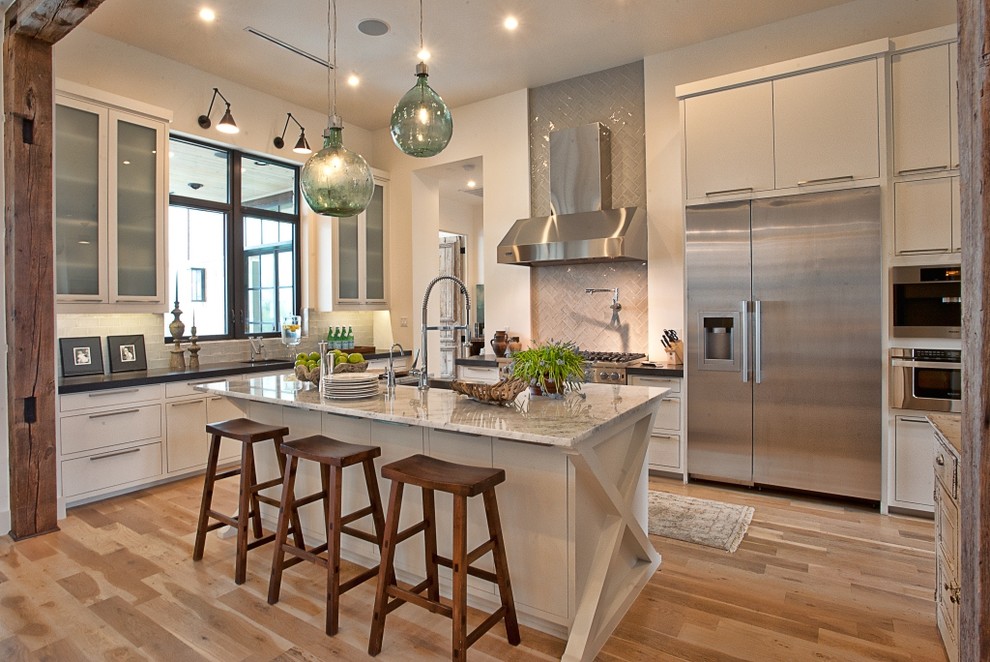 Transitional kitchen in Austin with stainless steel appliances.