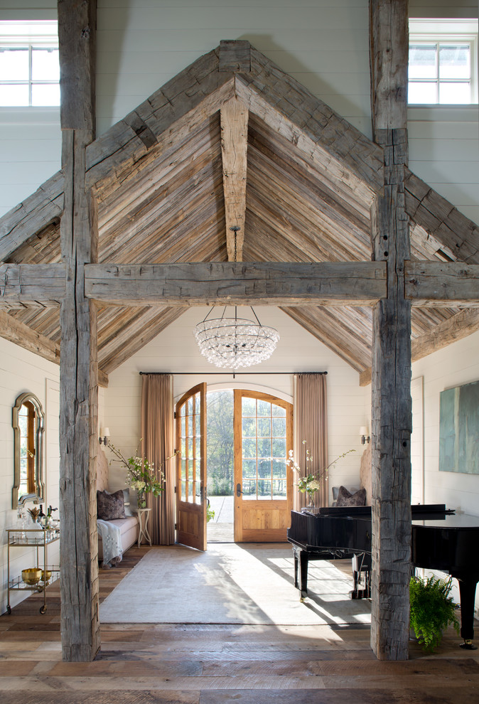 Mountain style dark wood floor foyer photo in Denver with beige walls and a medium wood front door