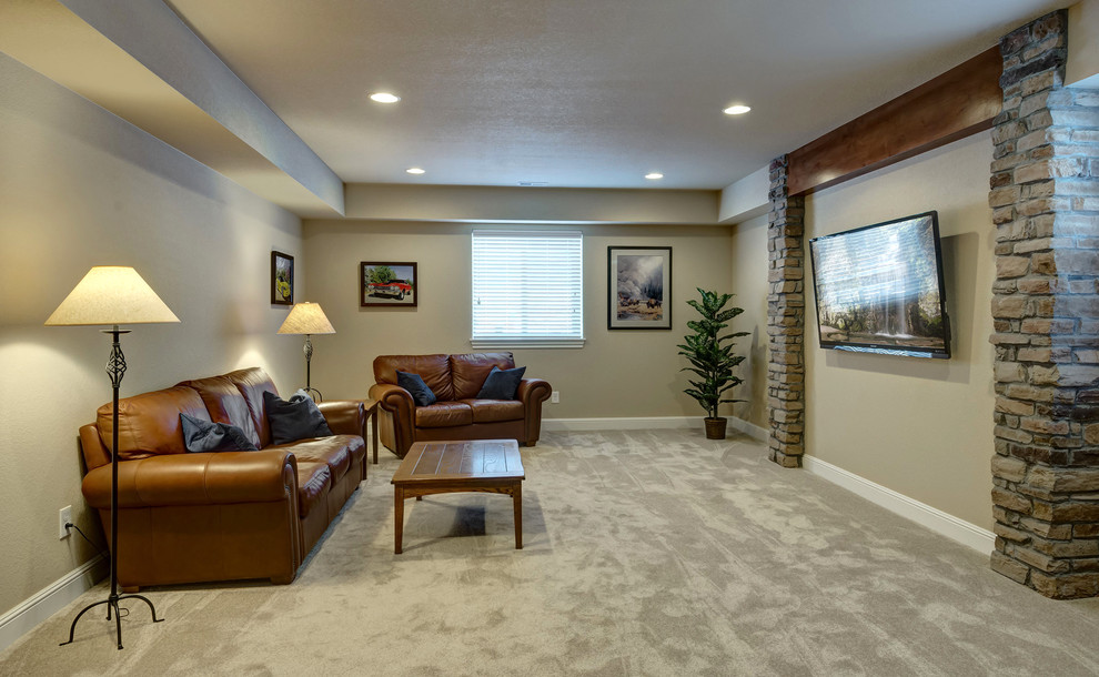 Expansive traditional look-out basement in Denver with beige walls, carpet, no fireplace and grey floor.