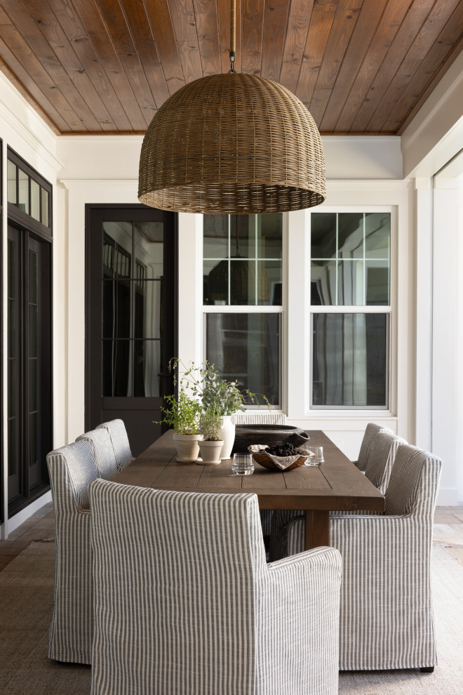 This is an example of a transitional porch design in Orlando.