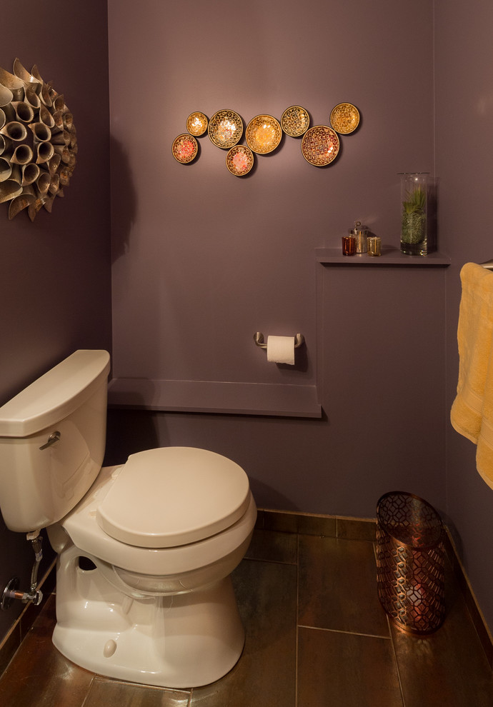 Small transitional powder room in Chicago with a two-piece toilet, porcelain tile, purple walls, porcelain floors and a pedestal sink.