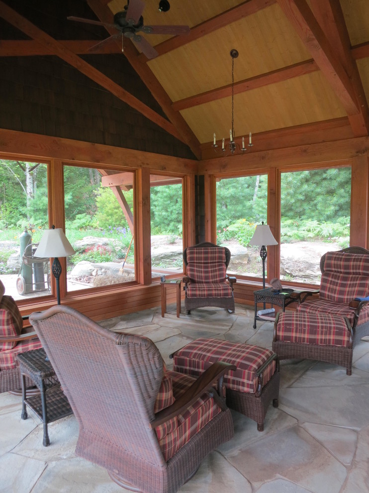 This is an example of a large country side yard verandah in Burlington with natural stone pavers.