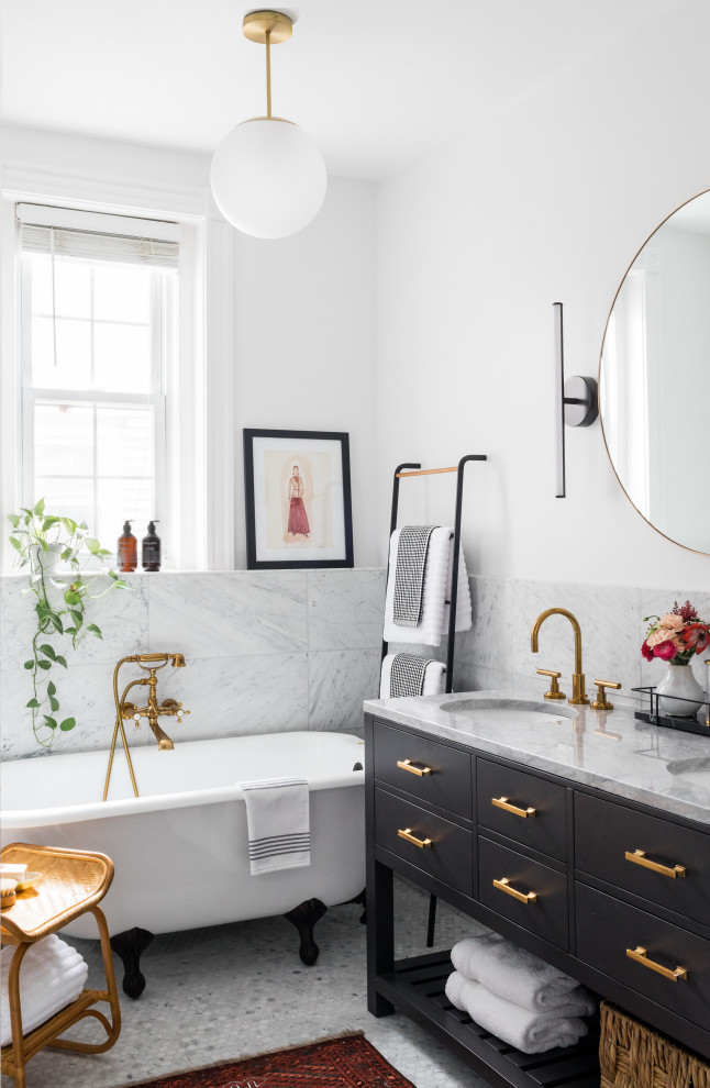 This is an example of a mid-sized transitional master bathroom in Boston with flat-panel cabinets, black cabinets, a freestanding tub, gray tile, porcelain tile, white walls, an undermount sink, grey floor and grey benchtops.