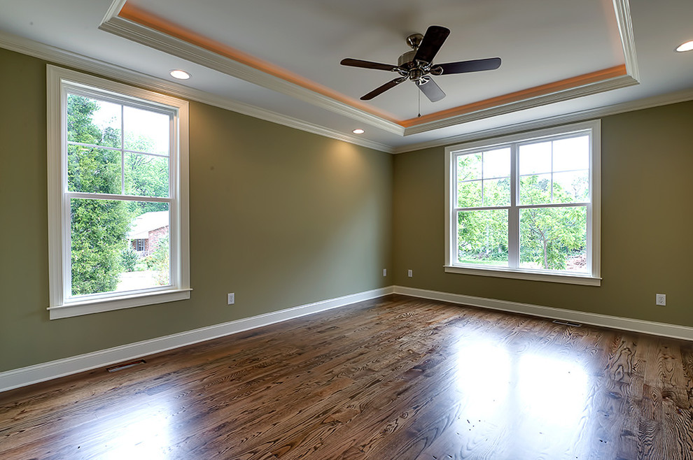 Transitional dark wood floor enclosed dining room photo with green walls and no fireplace