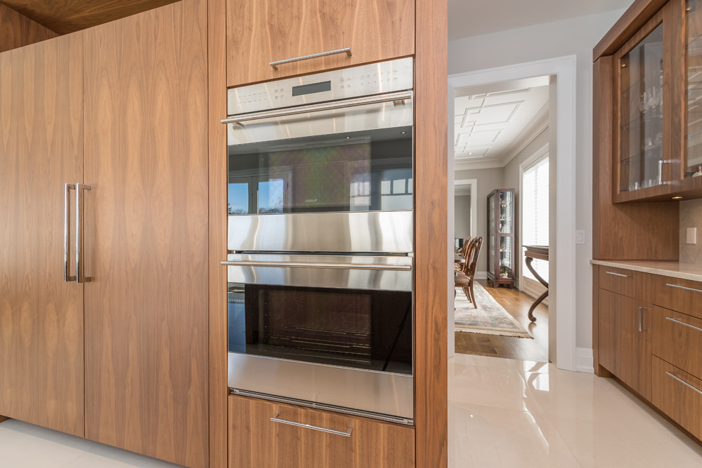 Example of a transitional kitchen design in Toronto