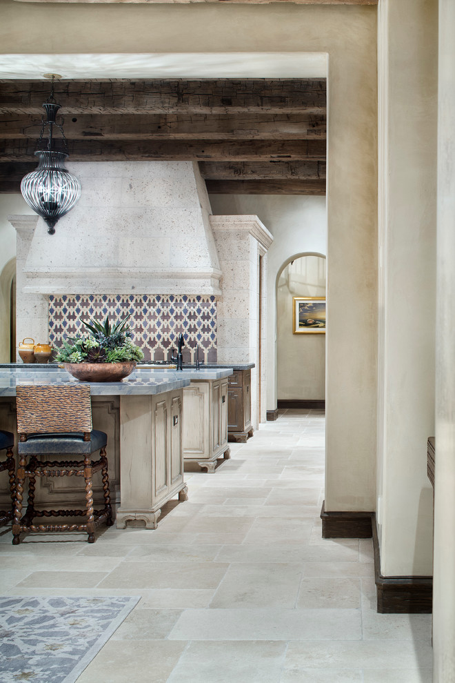 Inspiration for a mediterranean kitchen pantry remodel in Houston with two islands