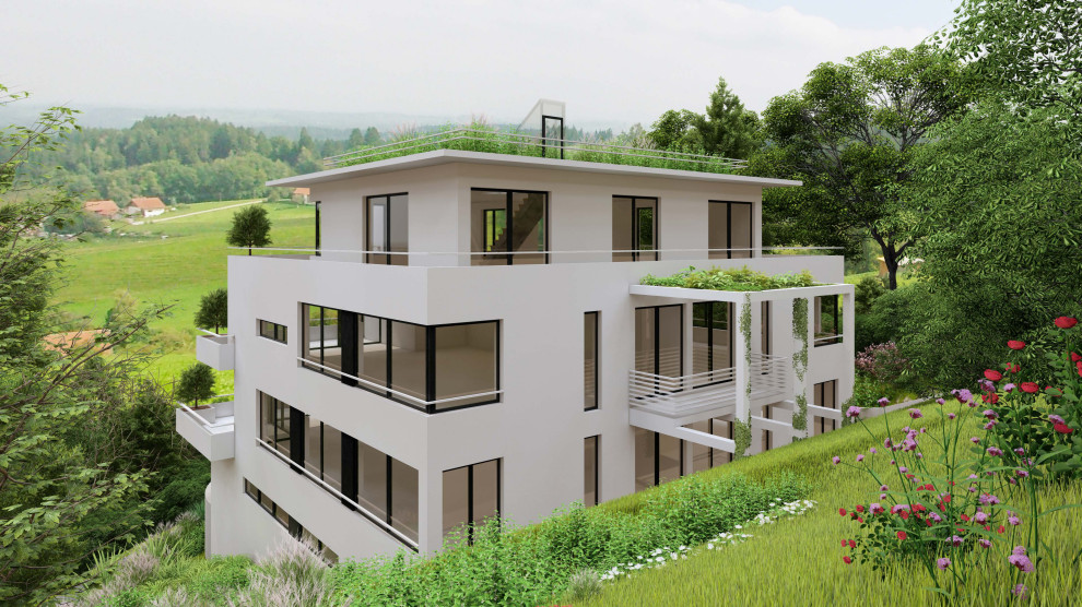 Großes, Dreistöckiges Modernes Haus mit Betonfassade, weißer Fassadenfarbe und Flachdach in Frankfurt am Main