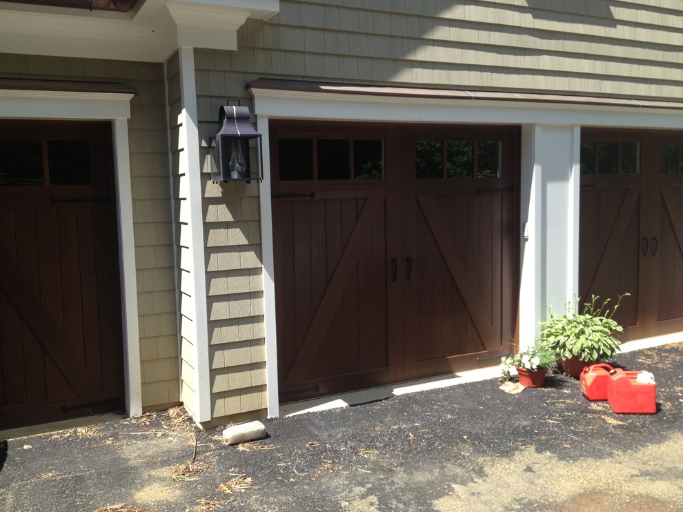 Inspiration for a mid-sized traditional attached three-car garage in Philadelphia.