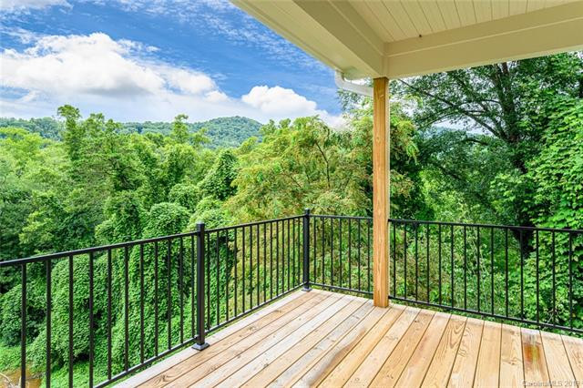 Example of a mid-sized transitional backyard deck design with a roof extension