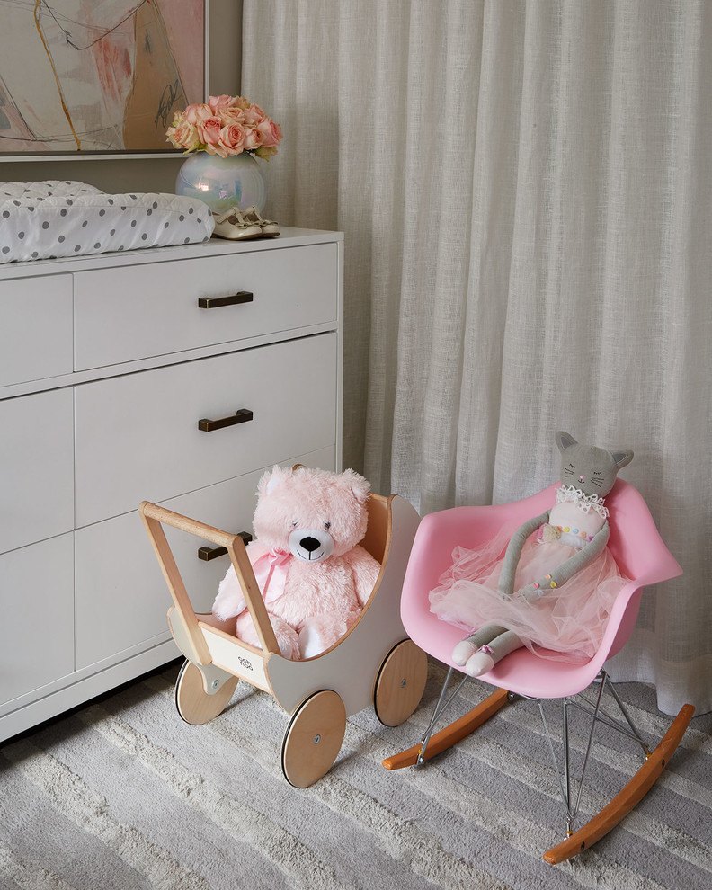 Inspiration for a mid-sized contemporary nursery for girls in Chicago with grey walls, dark hardwood floors and grey floor.