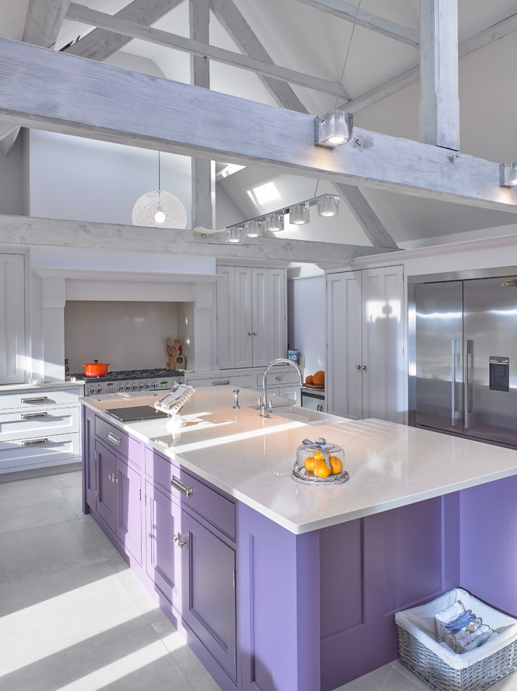 This is an example of a large traditional single-wall eat-in kitchen in Cheshire with a farmhouse sink, recessed-panel cabinets, purple cabinets, quartzite benchtops, beige splashback, stainless steel appliances, porcelain floors, with island, beige floor and beige benchtop.