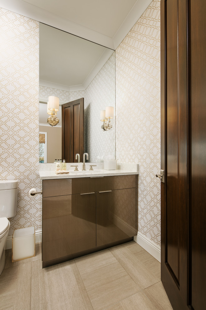 Example of a mid-sized transitional 3/4 beige tile and porcelain tile porcelain tile and beige floor corner shower design in Omaha with multicolored walls, an undermount sink, a two-piece toilet, a hinged shower door, flat-panel cabinets and brown cabinets