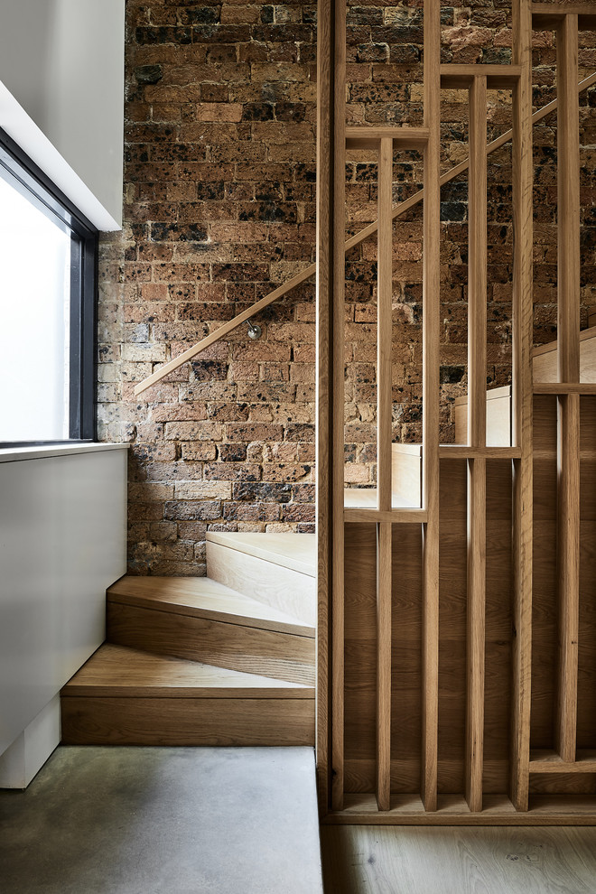 Scandinavian wood staircase in Sydney with wood risers and wood railing.