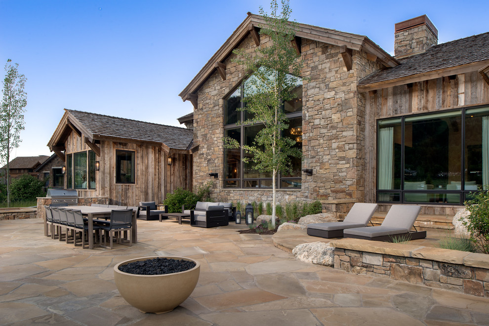 Inspiration for a country backyard patio in Other with an outdoor kitchen and no cover.