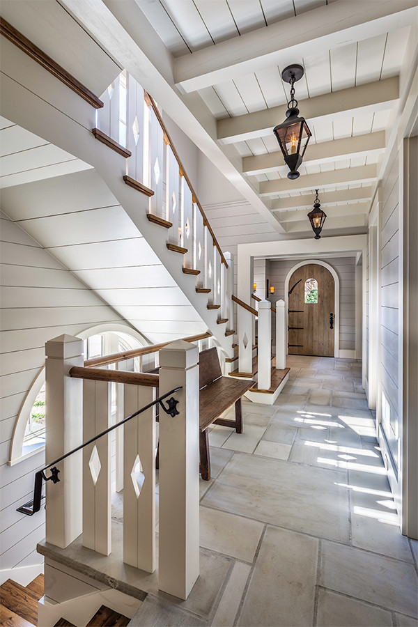 Inspiration for a mid-sized country hallway in Other with grey walls and limestone floors.