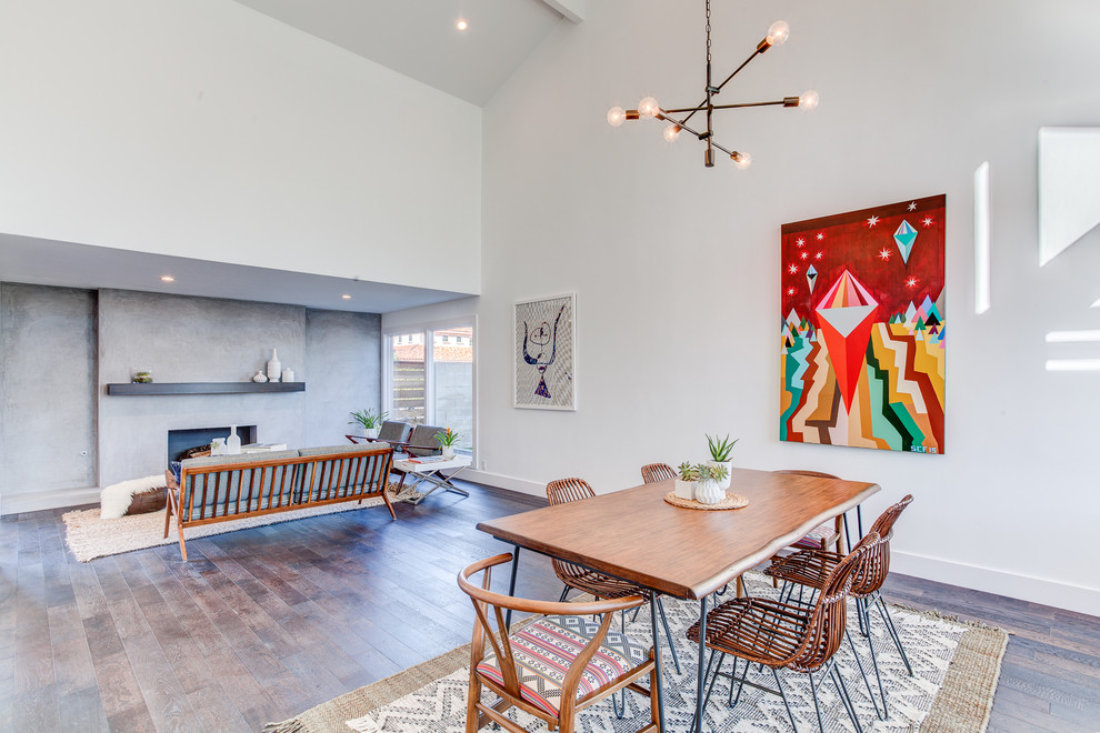 This is an example of a large contemporary open plan dining in Los Angeles with white walls and medium hardwood floors.