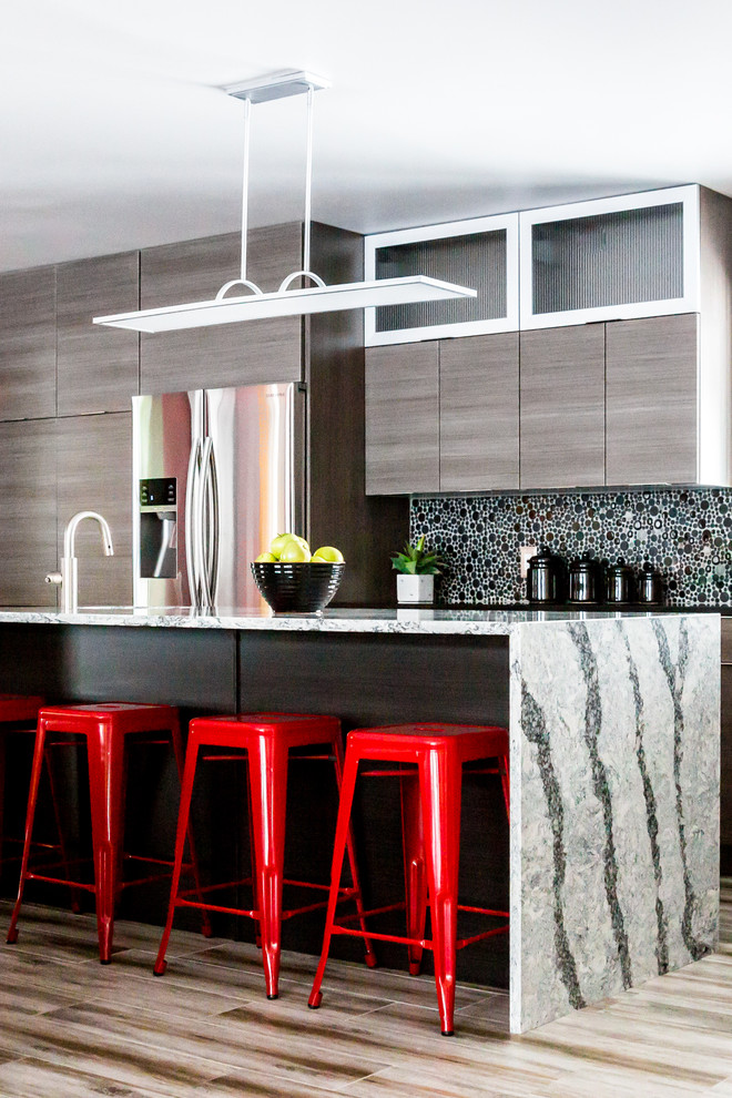 Inspiration for a mid-sized contemporary eat-in kitchen in Salt Lake City with an undermount sink, flat-panel cabinets, dark wood cabinets, granite benchtops, black splashback, mosaic tile splashback, stainless steel appliances, porcelain floors and with island.