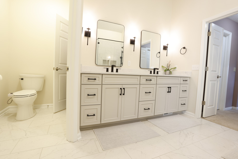 This is an example of a modern master bathroom in Cleveland with white cabinets, white tile, white walls, a double vanity and a built-in vanity.
