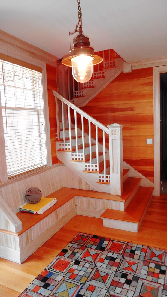 Design ideas for a large beach style wood u-shaped staircase in Other with painted wood risers.