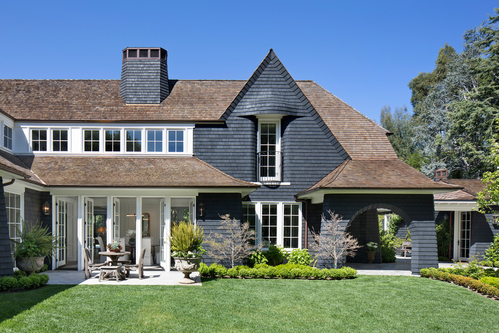 Traditional two-storey black house exterior in San Francisco with wood siding and a shingle roof.