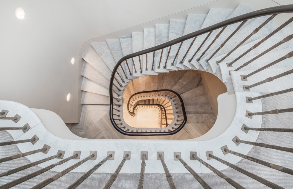 Inspiration for a large transitional staircase in London.