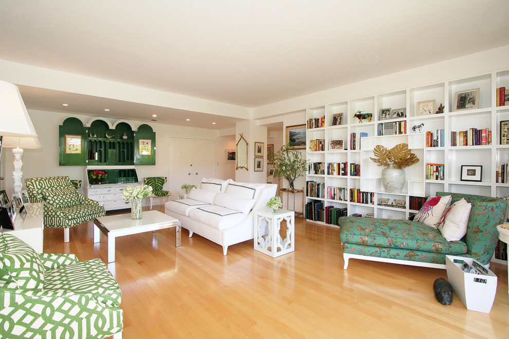 Inspiration for a contemporary living room in Los Angeles with a library and white walls.