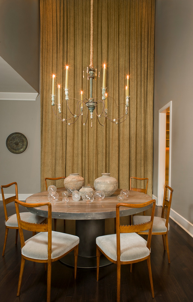 This is an example of a contemporary dining room in Chicago with grey walls and dark hardwood floors.