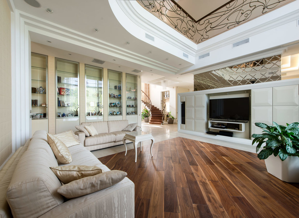 Large transitional open concept living room in Moscow with a library, beige walls, dark hardwood floors, a tile fireplace surround, brown floor and a wall-mounted tv.
