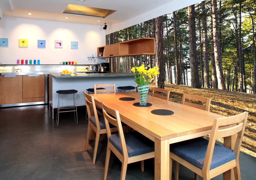 Photo of a contemporary eat-in kitchen in Other with flat-panel cabinets and medium wood cabinets.