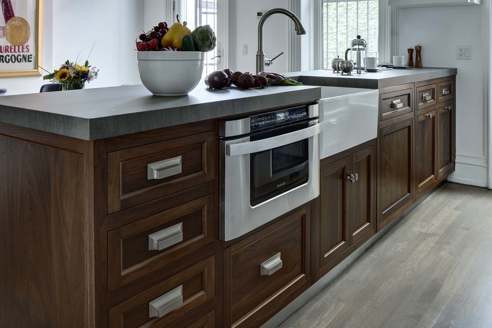 Example of a large transitional galley eat-in kitchen design in New York with a single-bowl sink, white backsplash and colored appliances
