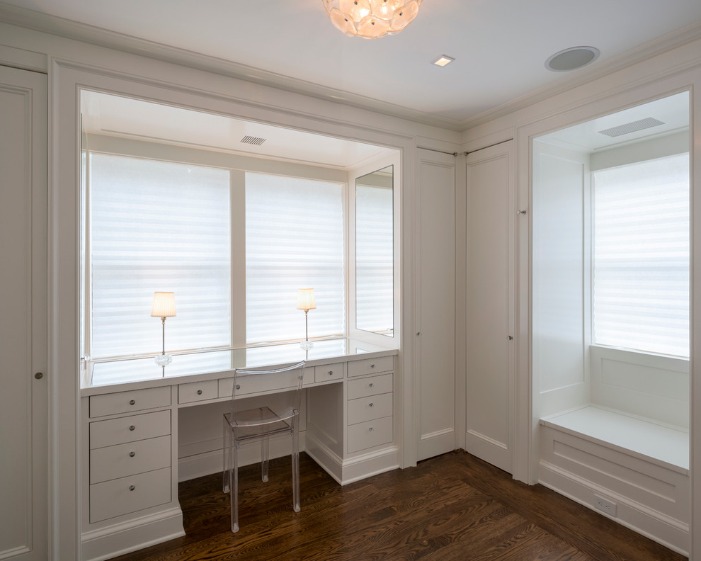 Design ideas for a large contemporary walk-in wardrobe in New York with recessed-panel cabinets, white cabinets and medium hardwood floors.